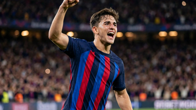 Gavi celebrating for Barcelona at a floodlit night stadium